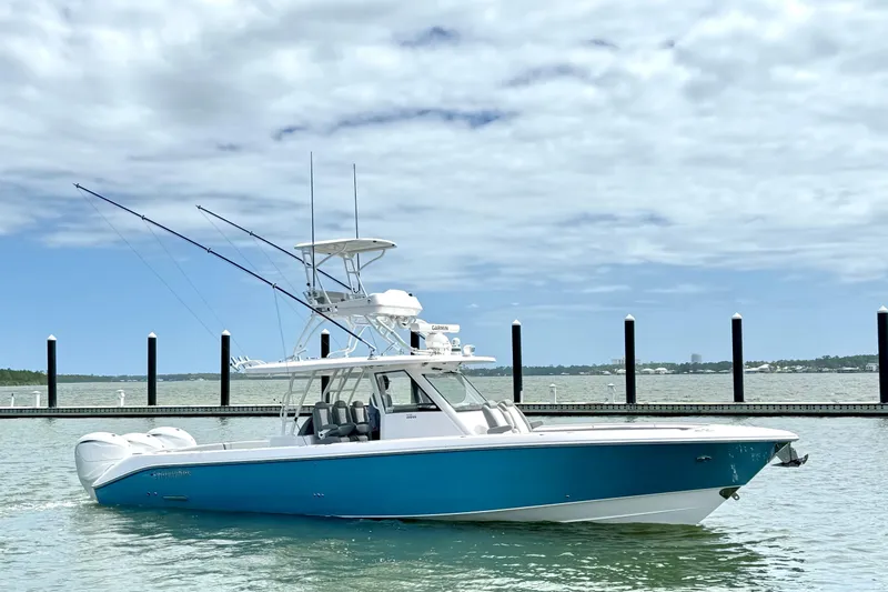 Slide: The Image of 2023 Everglades 395 Center Console boat docked on a sunny day. - 4