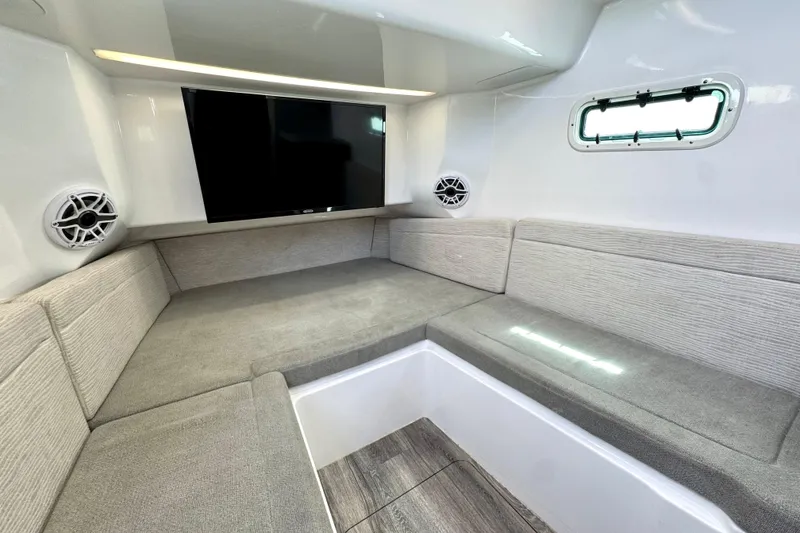 Slide: The Image of Luxurious interior of 2023 Everglades 395 Center Console boat with seating and TV. - 50