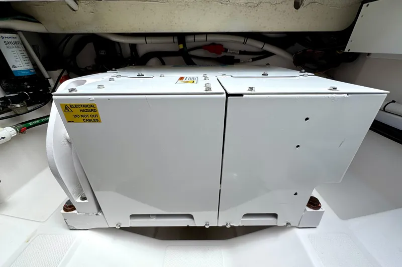 Slide: The Image of Electrical equipment in 2023 Everglades 395 Center Console boat, warning label visible. - 52