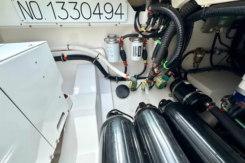 Slide: The Image of Engine compartment of 2023 Everglades 395 Center Console with wiring and components. - 53