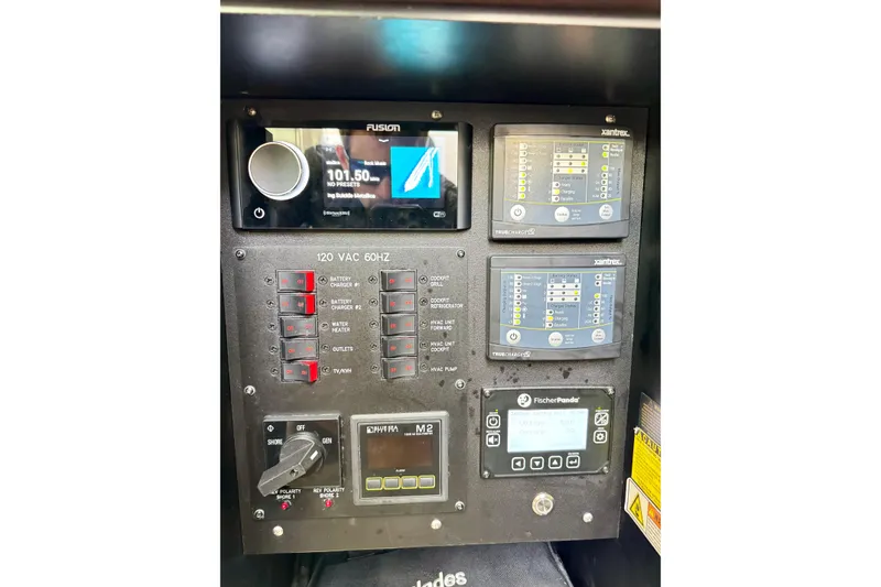 Slide: The Image of Control panel of 2023 Everglades 395 Center Console boat with various electronic displays. - 57
