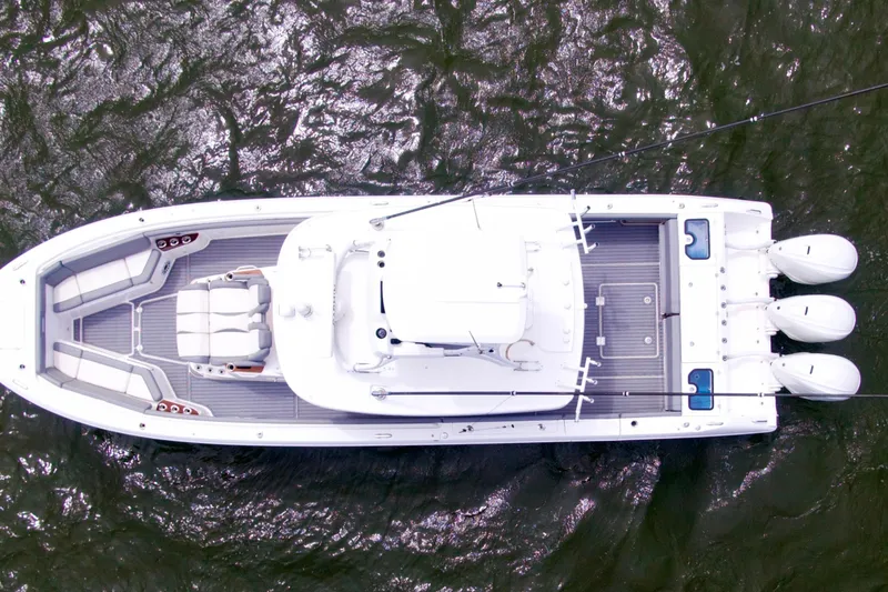 Slide: The Image of Overhead view of 2023 Everglades 395 Center Console boat on water. - 8