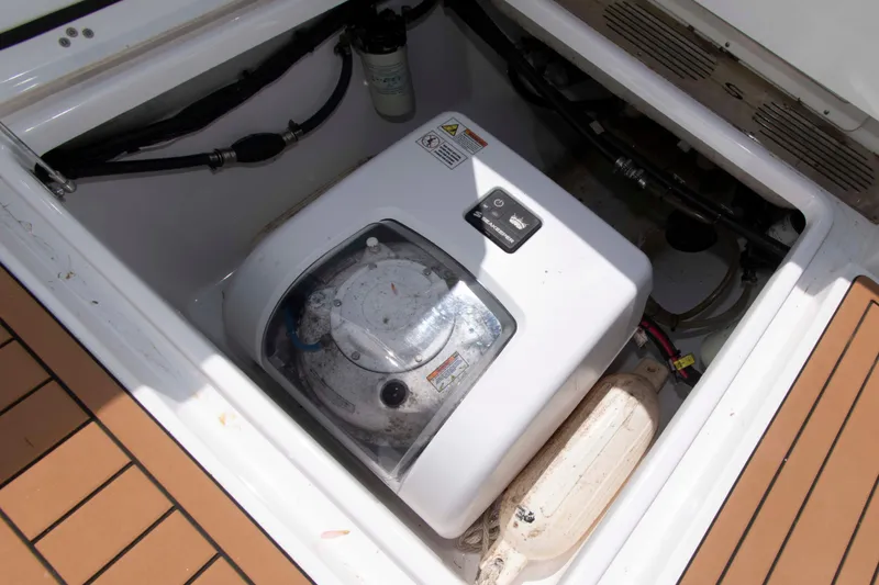 Slide: The Image of 2022 Sportsman Open 282 Center Console boat's engine compartment with visible components. - 19