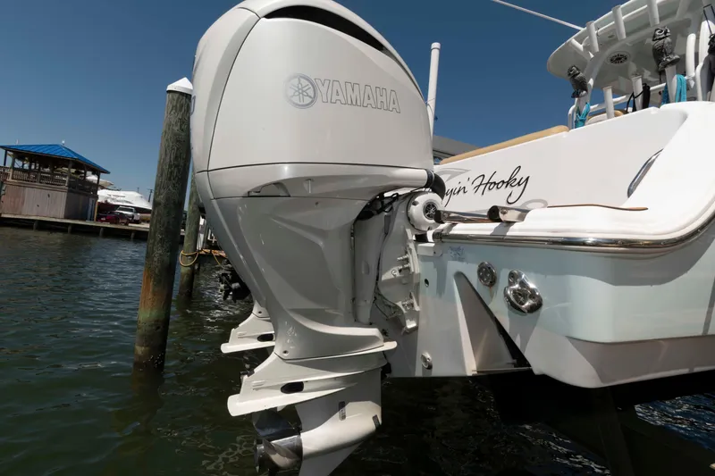 Slide: The Image of 2022 Sportsman Open 282 Center Console with Yamaha outboard engine at dockside. - 20