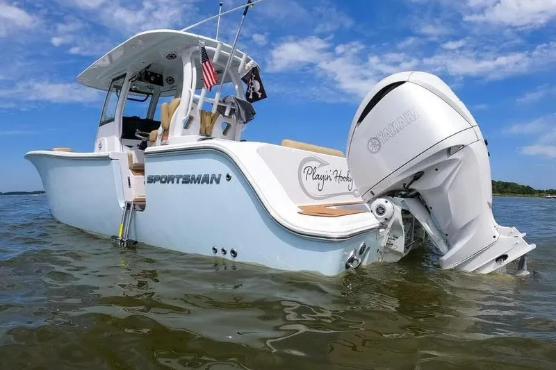 Slide: The Image of 2022 Sportsman Open 282 Center Console boat with Yamaha engine in shallow water. - 3