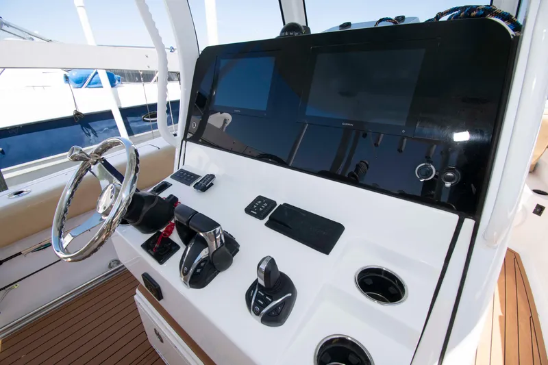 Slide: The Image of 2022 Sportsman Open 282 Center Console helm with modern controls and displays. - 9