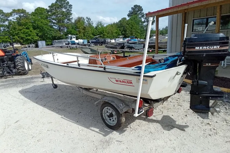 Slide: The Image of 1985 Boston Whaler 13 Sport boat on trailer with Mercury outboard motor. - 10