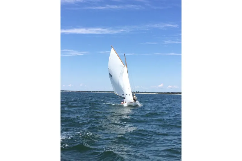 Slide: The Image of Sailing on a Wianno Senior boat, 2020 model, under clear blue skies. - 4
