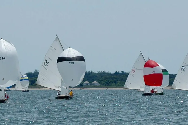 Slide: The Image of Sailboats racing on water, featuring 2020 Wianno Senior models with colorful spinnakers. - 9