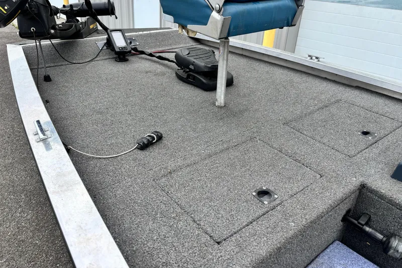 Slide: The Image of 1991 Bass Tracker Tournament TX-17 boat deck with fishing seat and equipment. - 3