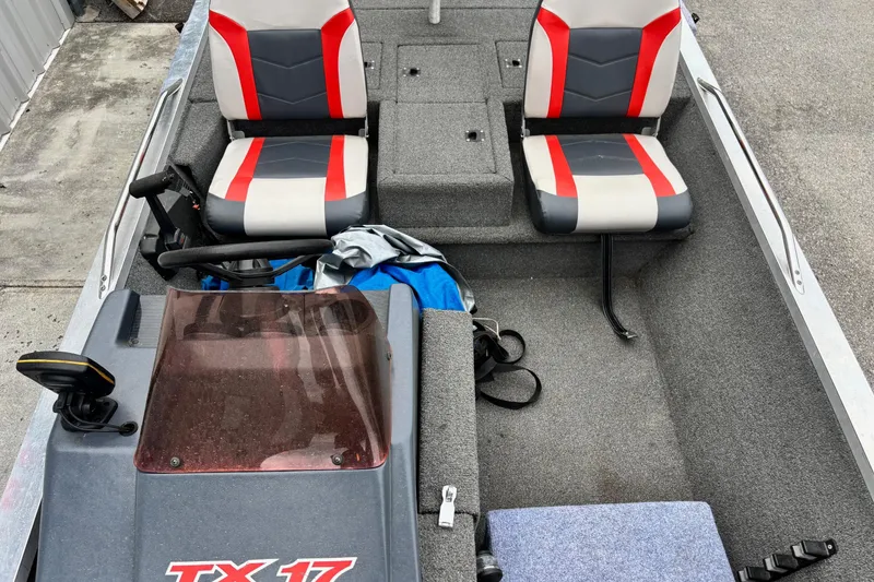 Slide: The Image of 1991 Bass Tracker Tournament TX-17 boat interior with dual seats and steering console. - 5