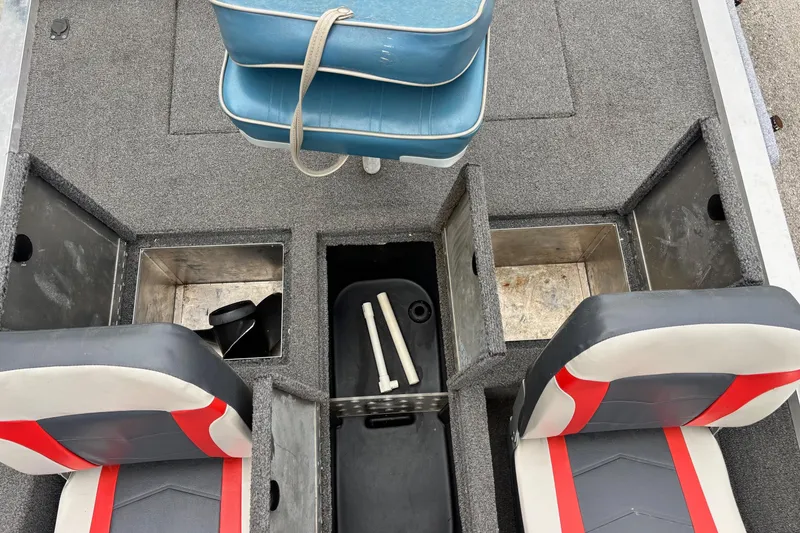 Slide: The Image of 1991 Bass Tracker Tournament TX-17 boat interior with storage compartments and seating. - 8