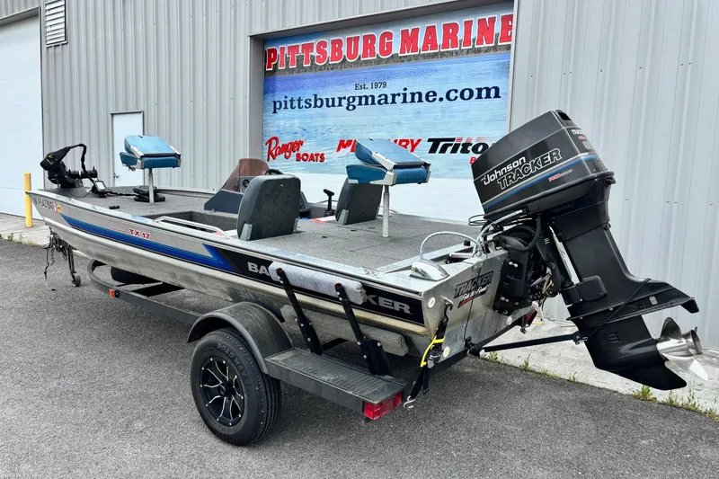 Slide: The Image of 1991 Bass Tracker Tournament TX-17 boat with Johnson Tracker outboard motor at Pittsburg Marine. - 9