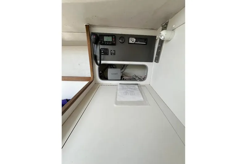 Slide: The Image of Interior view of 2001 J Boats J/105 navigation station with equipment and documents. - 10