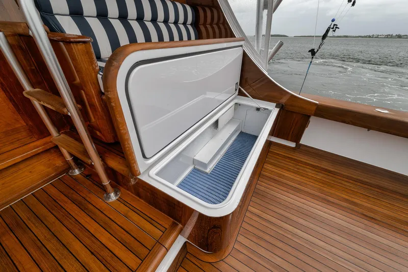 Slide: The Image of Luxurious 2011 Jim Smith Custom Sportfish boat with elegant wood deck and built-in storage. - 14