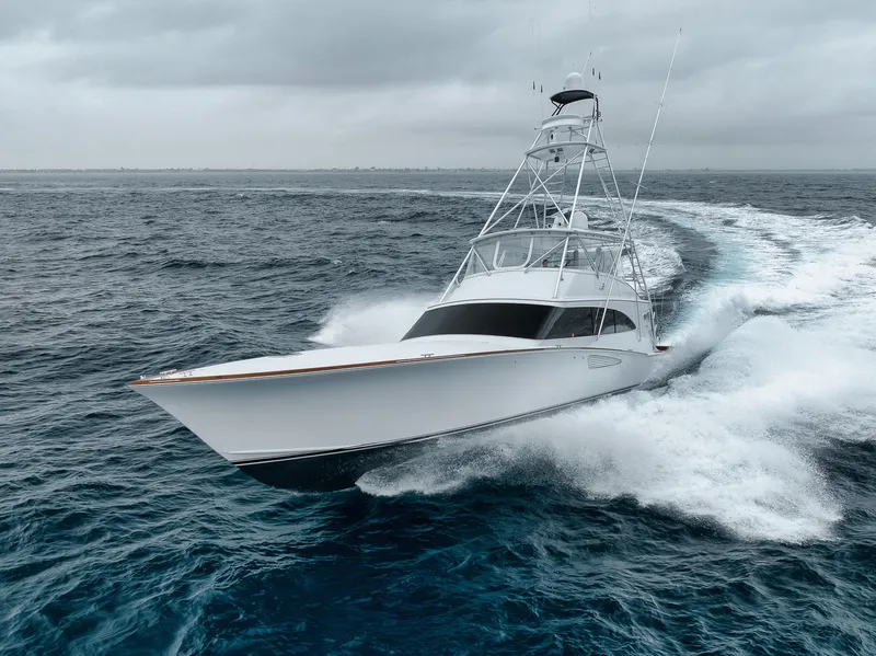 Slide: The Image of 2011 Jim Smith Custom Sportfish yacht cruising on open ocean waters. - 2
