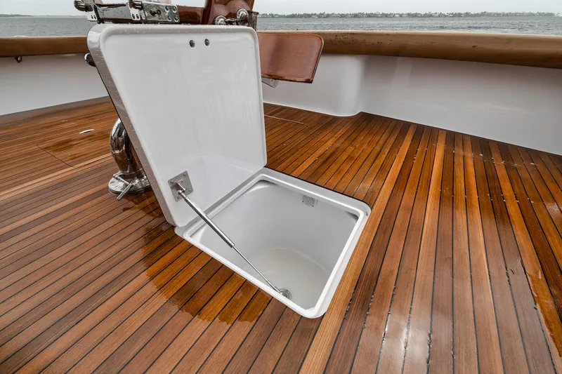 Slide: The Image of Open hatch on 2011 Jim Smith Custom Sportfish boat with wooden deck. - 21