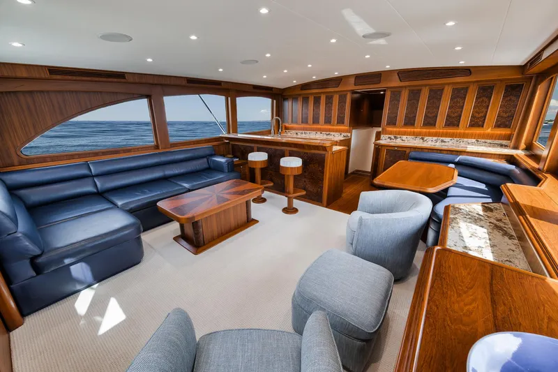 Slide: The Image of Luxurious interior of 2011 Jim Smith Custom Sportfish yacht with elegant seating and wood finishes. - 22