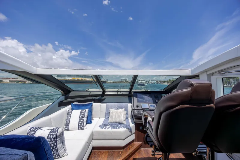 Slide: The Image of Luxurious interior of 2020 Sunseeker Predator 74 XPS yacht with plush seating and panoramic views. - 100