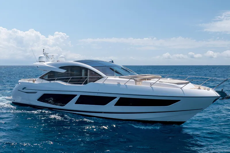 Slide: The Image of 2020 Sunseeker Predator 74 XPS yacht cruising on open sea under clear skies. - 104