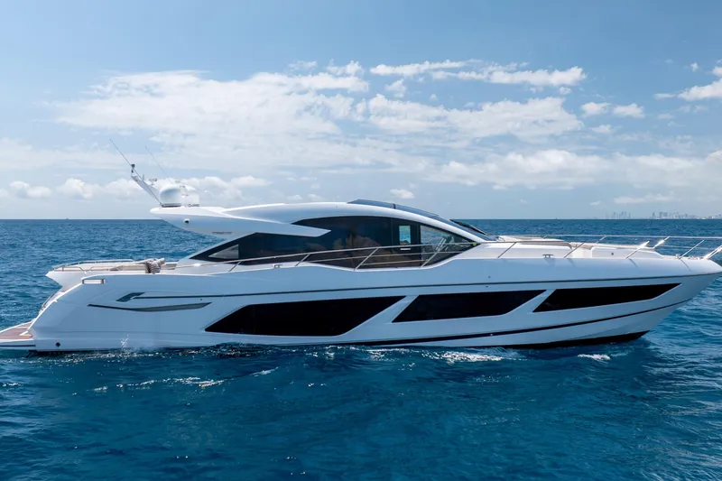 Slide: The Image of 2020 Sunseeker Predator 74 XPS yacht cruising on open blue sea under clear sky. - 105