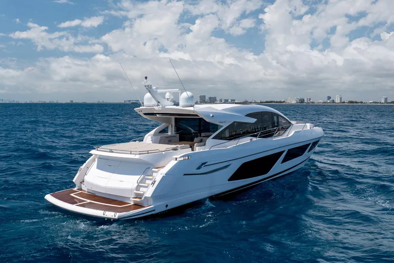 Slide: The Image of 2020 Sunseeker Predator 74 XPS yacht cruising on open sea under blue sky. - 106