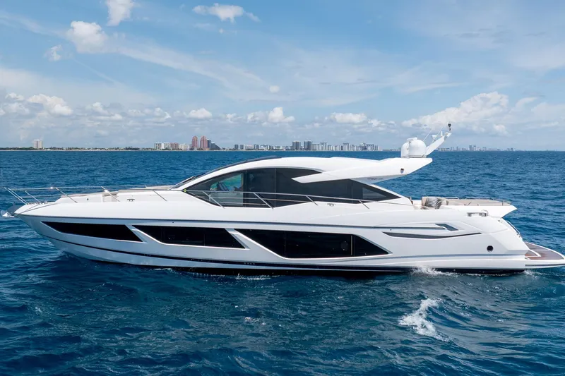 Slide: The Image of 2020 Sunseeker Predator 74 XPS yacht cruising on open sea under clear skies. - 108