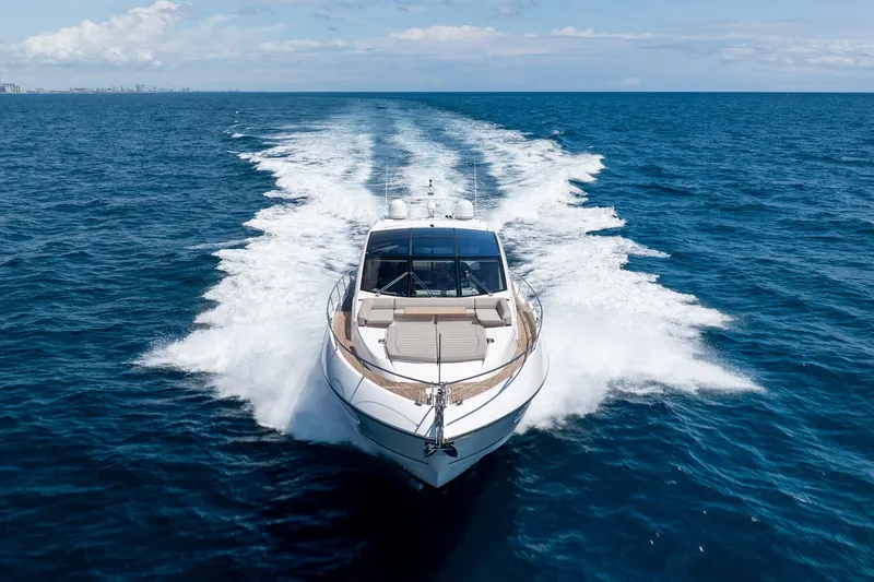 Slide: The Image of Sunseeker Predator 74 XPS 2020 yacht cruising on open ocean under clear skies. - 115