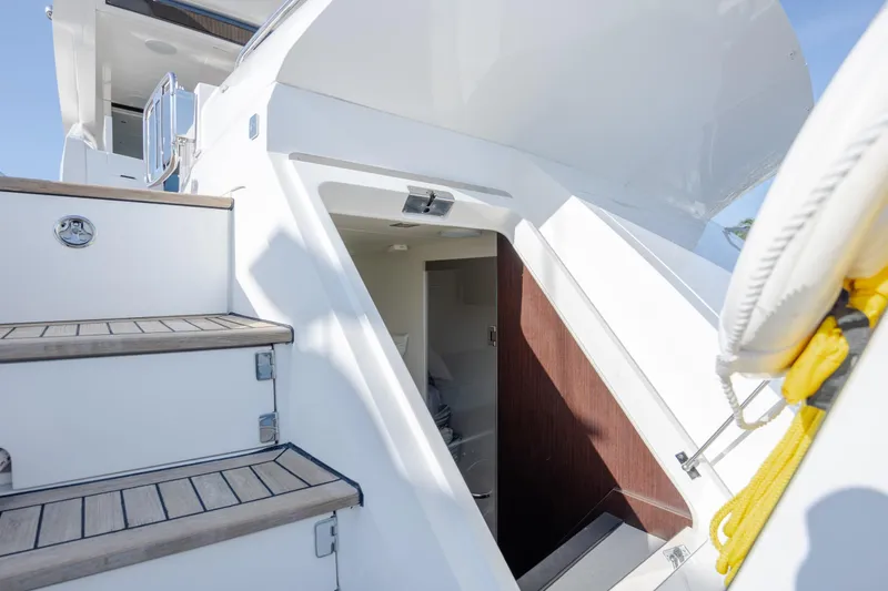 Slide: The Image of Staircase and entrance on 2020 Sunseeker Predator 74 XPS yacht, showcasing sleek design. - 12
