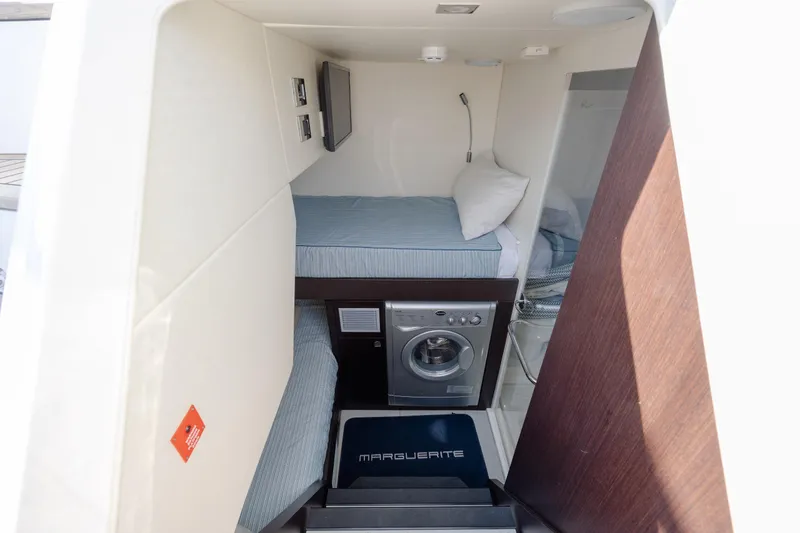 Slide: The Image of Interior cabin of 2020 Sunseeker Predator 74 XPS with bunk beds and washing machine. - 13