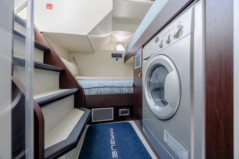 Slide: The Image of Laundry area with washer in 2020 Sunseeker Predator 74 XPS yacht interior. - 15