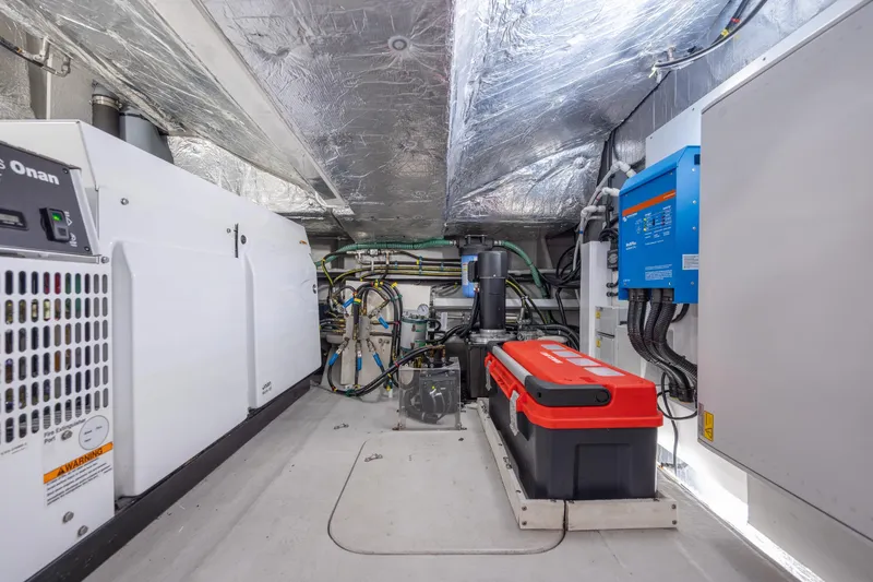 Slide: The Image of Engine room of 2020 Sunseeker Predator 74 XPS yacht, featuring advanced equipment and wiring. - 27