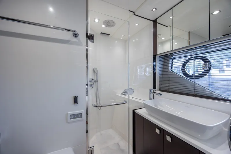 Slide: The Image of Luxurious bathroom in 2020 Sunseeker Predator 74 XPS yacht, featuring modern fixtures and elegant design. - 39