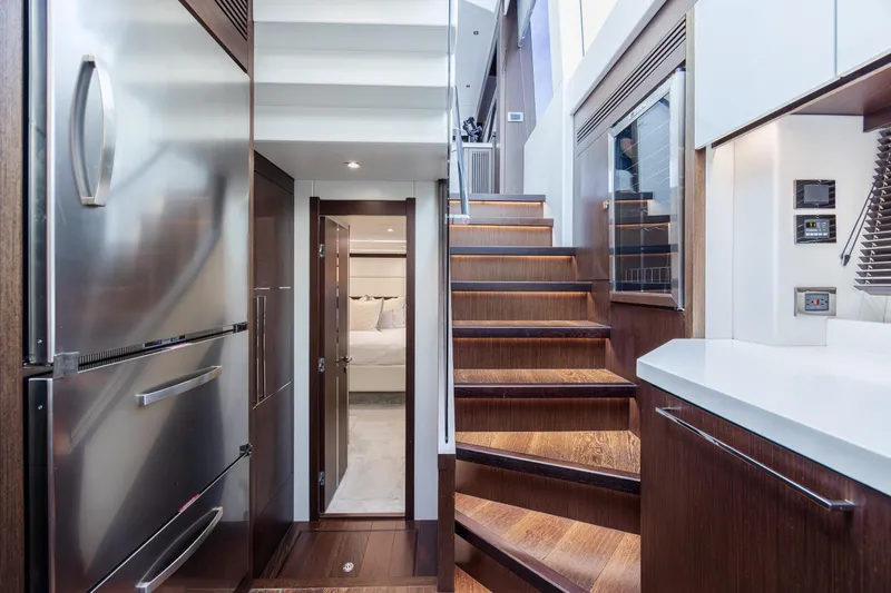 Slide: The Image of Luxurious interior of 2020 Sunseeker Predator 74 XPS yacht with modern kitchen and staircase. - 43