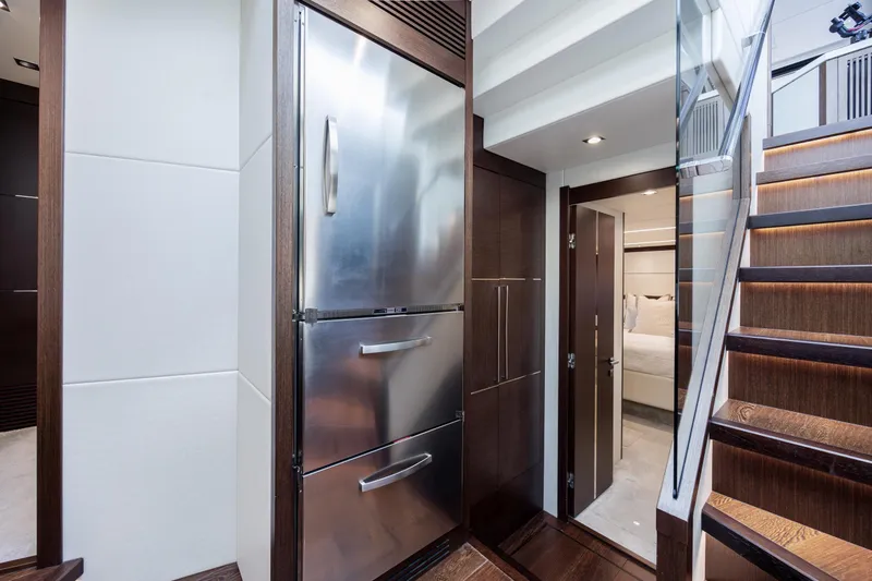 Slide: The Image of Luxurious interior of 2020 Sunseeker Predator 74 XPS yacht with modern kitchen and staircase. - 44