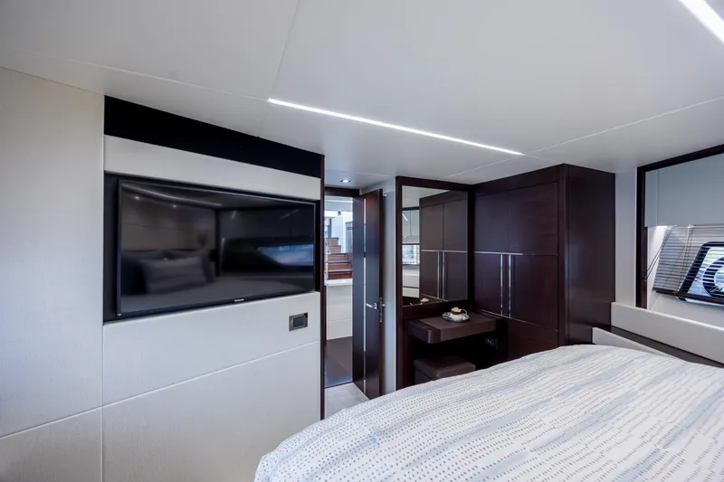 Slide: The Image of Luxurious interior of 2020 Sunseeker Predator 74 XPS yacht bedroom with modern amenities. - 49