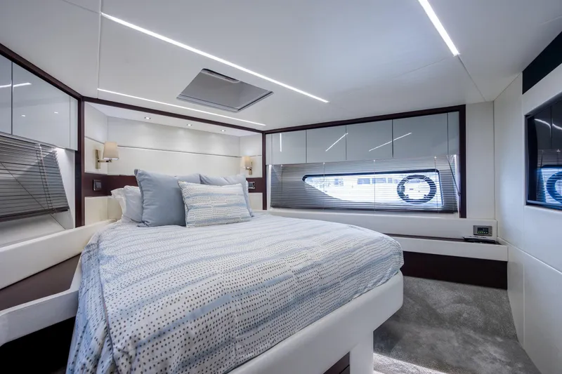 Slide: The Image of Luxurious bedroom interior of 2020 Sunseeker Predator 74 XPS yacht, featuring modern design and elegant decor. - 5