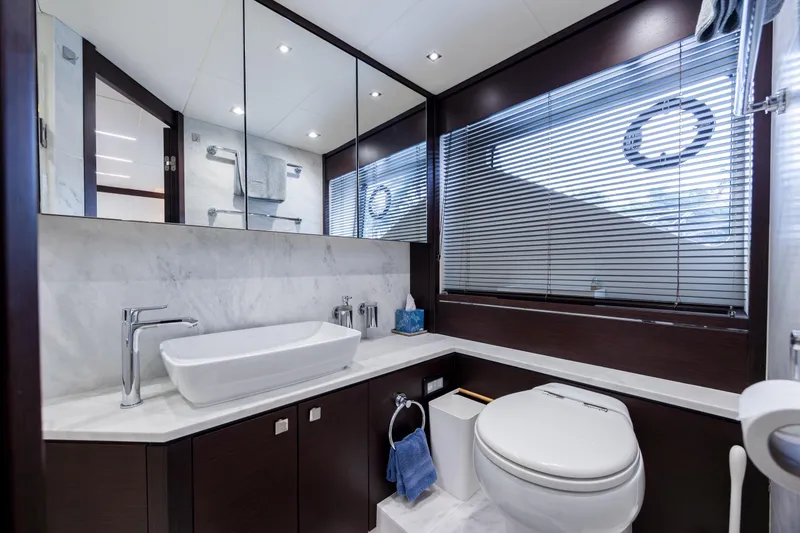 Slide: The Image of Luxurious bathroom interior on 2020 Sunseeker Predator 74 XPS yacht, featuring modern fixtures and elegant design. - 54