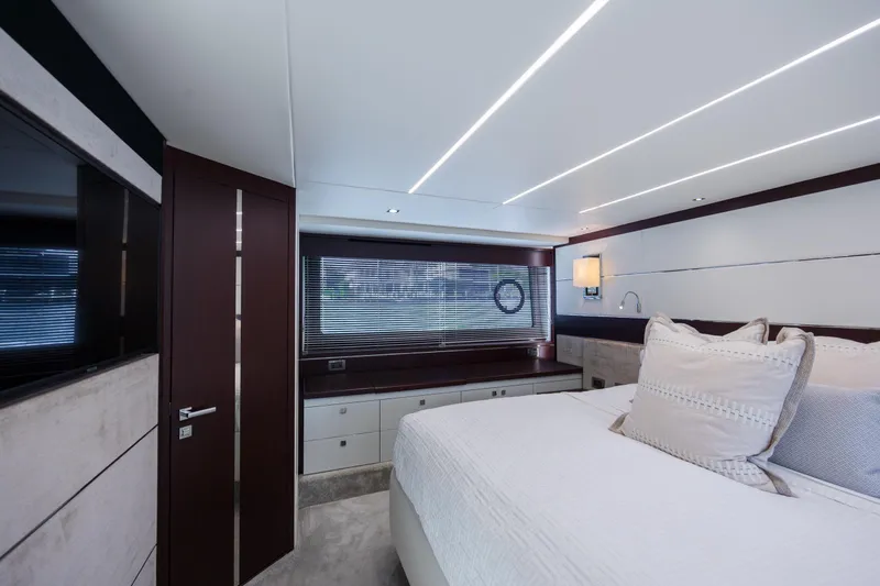Slide: The Image of Luxurious bedroom interior of 2020 Sunseeker Predator 74 XPS yacht, featuring modern design and elegant decor. - 57