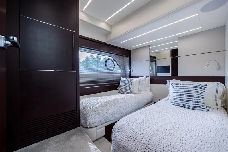 Slide: The Image of Luxurious twin bedroom in 2020 Sunseeker Predator 74 XPS yacht, featuring modern design. - 6