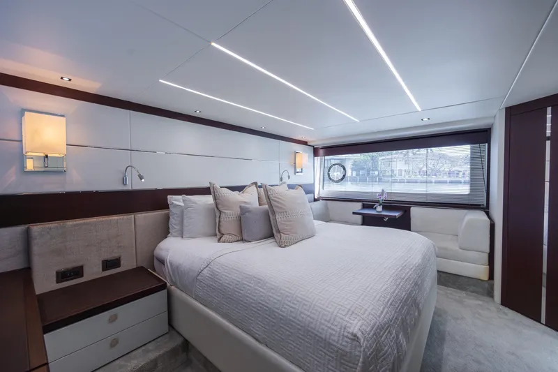 Slide: The Image of Luxurious bedroom interior of 2020 Sunseeker Predator 74 XPS yacht, featuring modern design and elegant furnishings. - 60