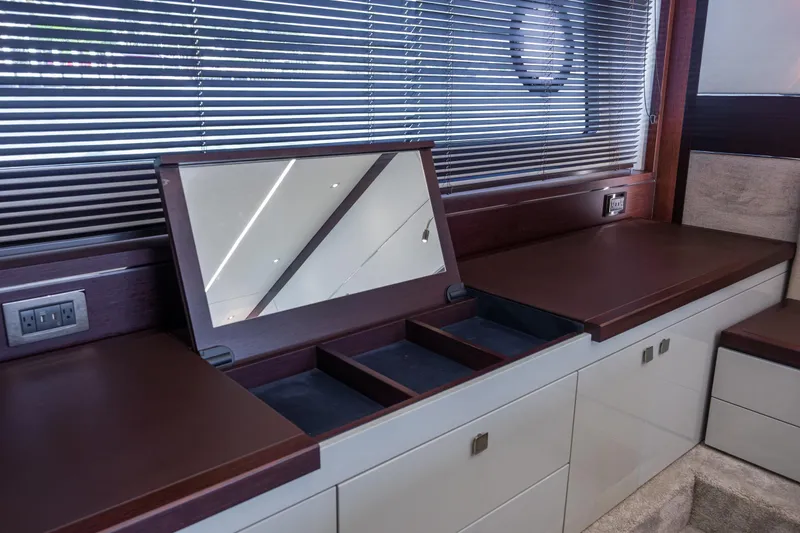 Slide: The Image of Luxurious interior of 2020 Sunseeker Predator 74 XPS yacht with sleek cabinetry and mirror. - 61