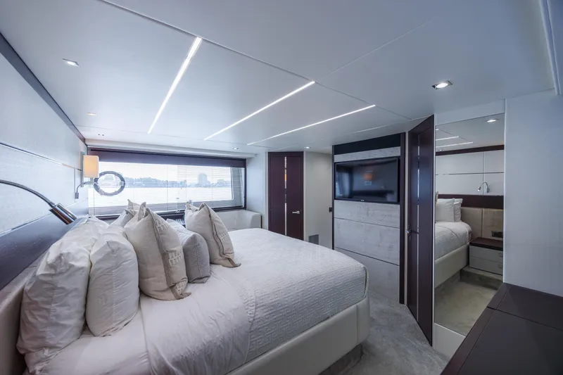 Slide: The Image of Luxurious bedroom interior of 2020 Sunseeker Predator 74 XPS yacht, featuring modern design. - 62