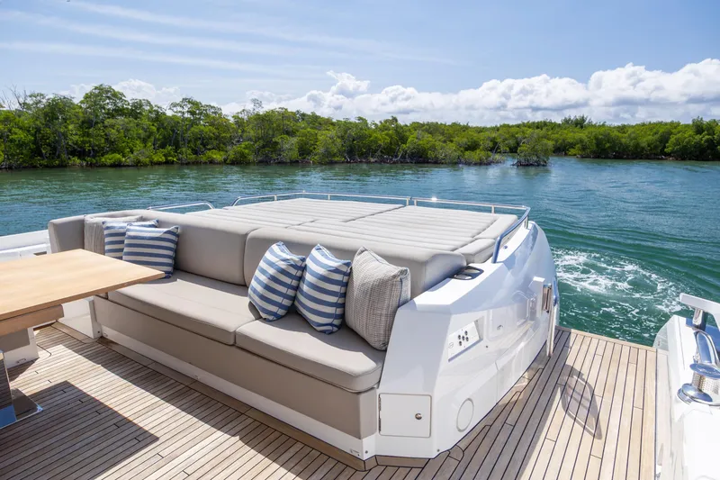 Slide: The Image of Luxurious Sunseeker Predator 74 XPS yacht deck with seating, 2020 model, scenic water view. - 66