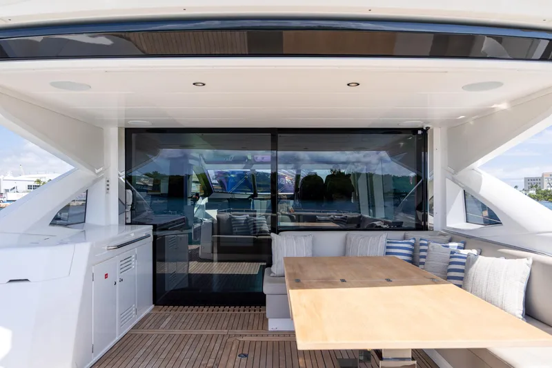 Slide: The Image of Luxury Sunseeker Predator 74 XPS yacht deck with seating and table, 2020 model. - 68