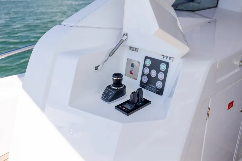 Slide: The Image of Control panel of 2020 Sunseeker Predator 74 XPS yacht, featuring joystick and switches. - 69