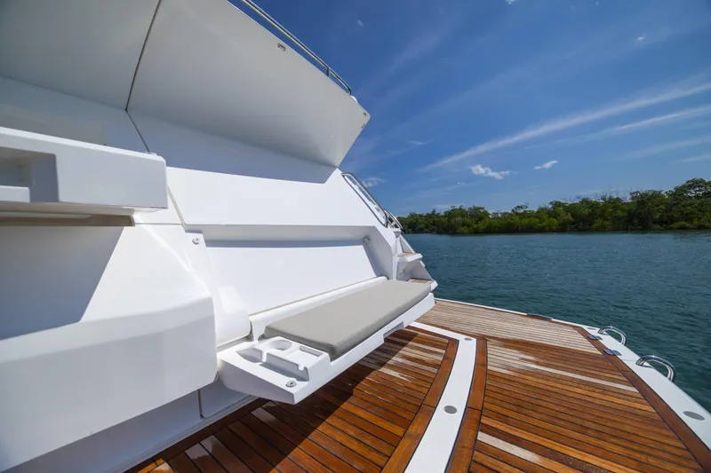 Slide: The Image of Luxury Sunseeker Predator 74 XPS yacht deck, 2020 model, with scenic water view. - 73