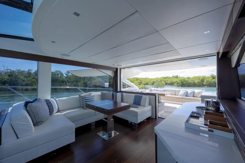 Slide: The Image of Luxurious interior of 2020 Sunseeker Predator 74 XPS yacht with elegant seating and scenic views. - 78