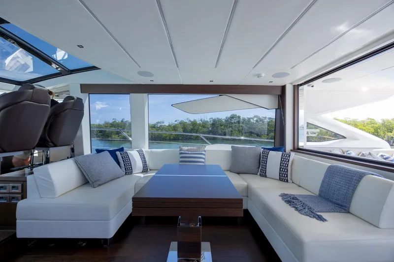 Slide: The Image of Luxurious interior of 2020 Sunseeker Predator 74 XPS yacht with elegant seating and panoramic windows. - 80