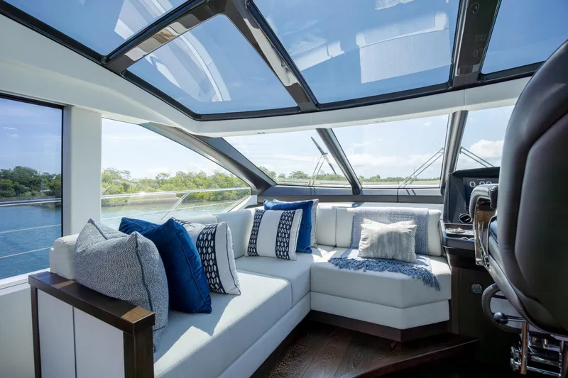 Slide: The Image of Luxurious interior of 2020 Sunseeker Predator 74 XPS yacht with plush seating and panoramic windows. - 86
